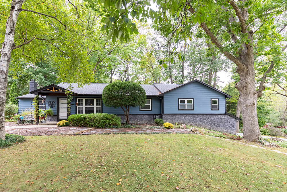 front door with landscaping